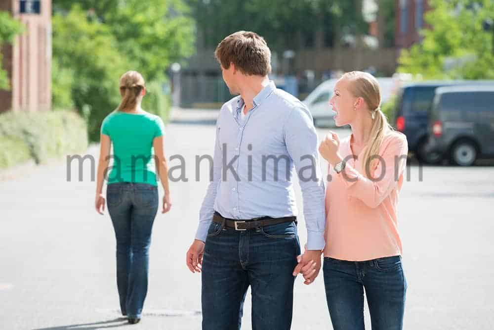 man looking at other woman
